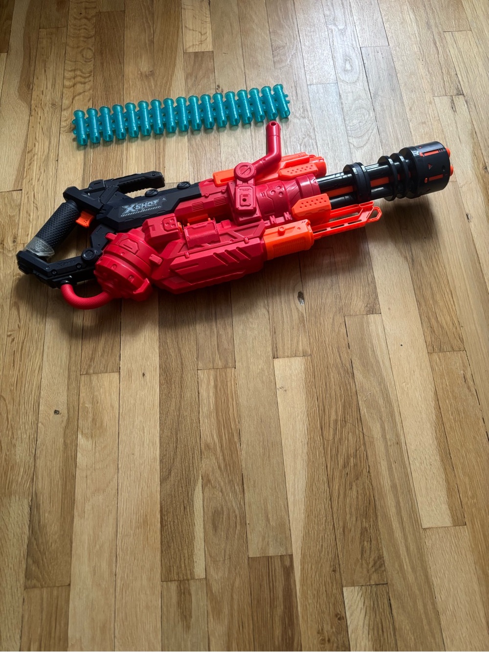 Red and Black Motorized Dart Blaster with Teal Dart Belt